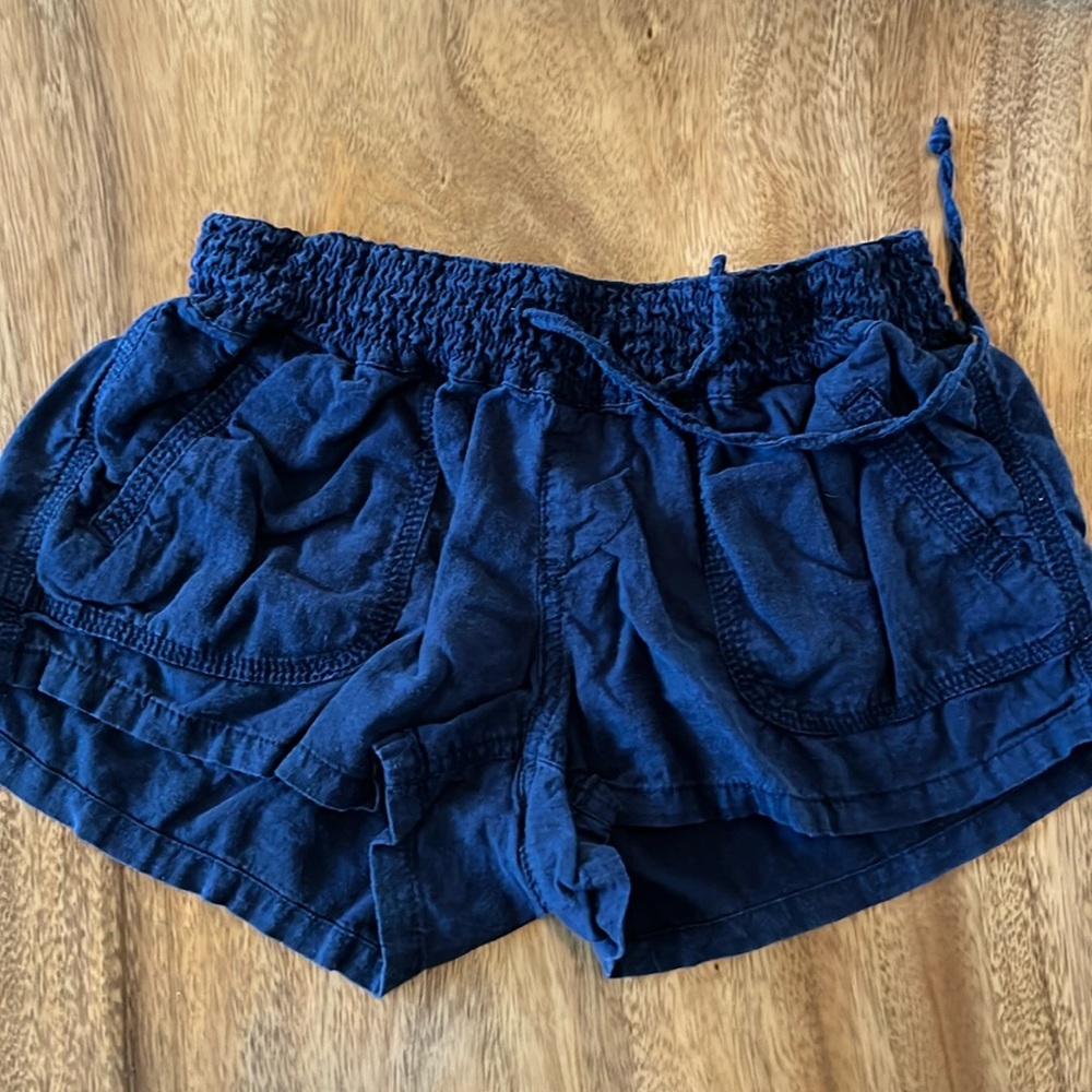 Women/juniors size small, dark blue cotton shorts.